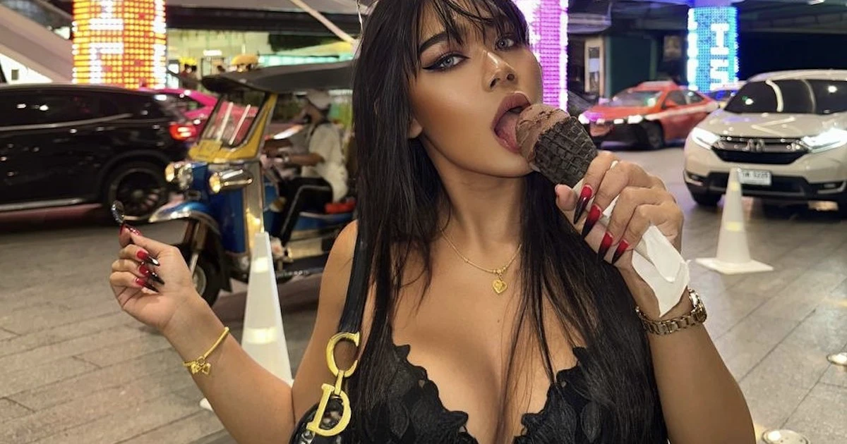 Cherlyn Asian eating an ice cream in a very suggestive way wearing a black top showing off her big boobs