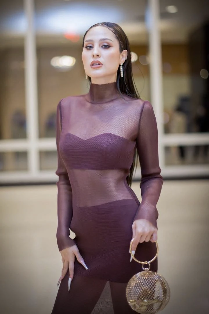 Cute thai girl Kwan Usamanee posing in a transparent dress and holding a luxury handbag