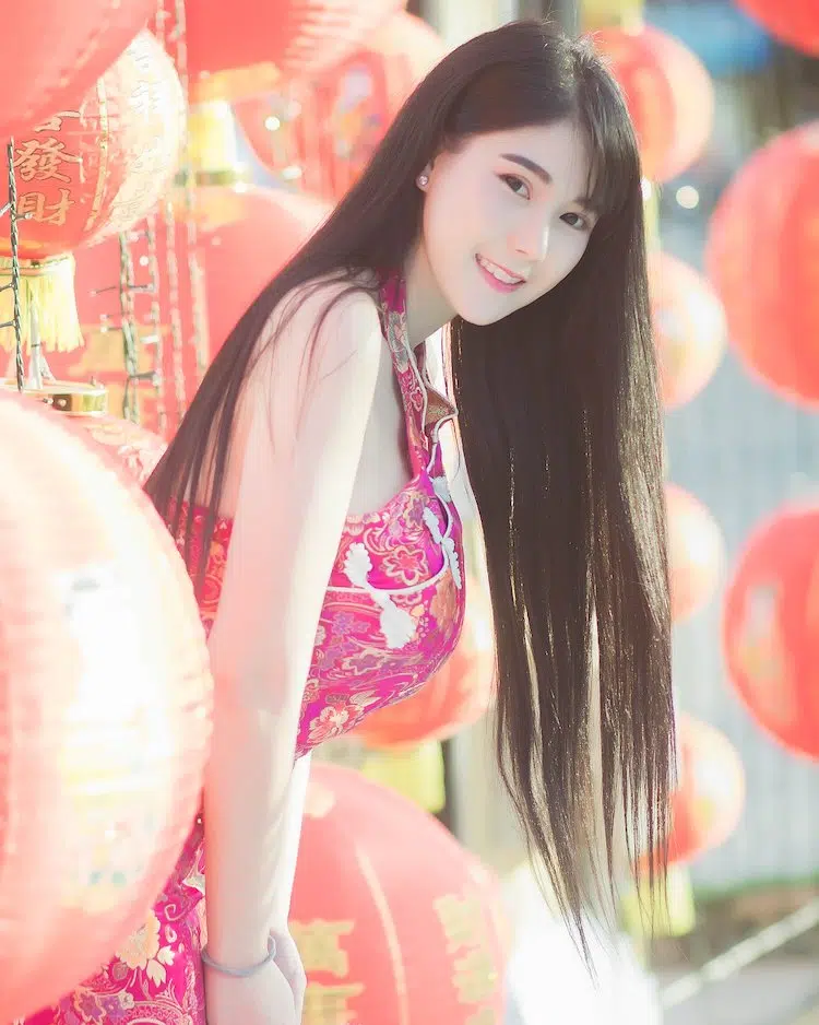 Kanyanat Puchaneeyakul in a Chinese dress