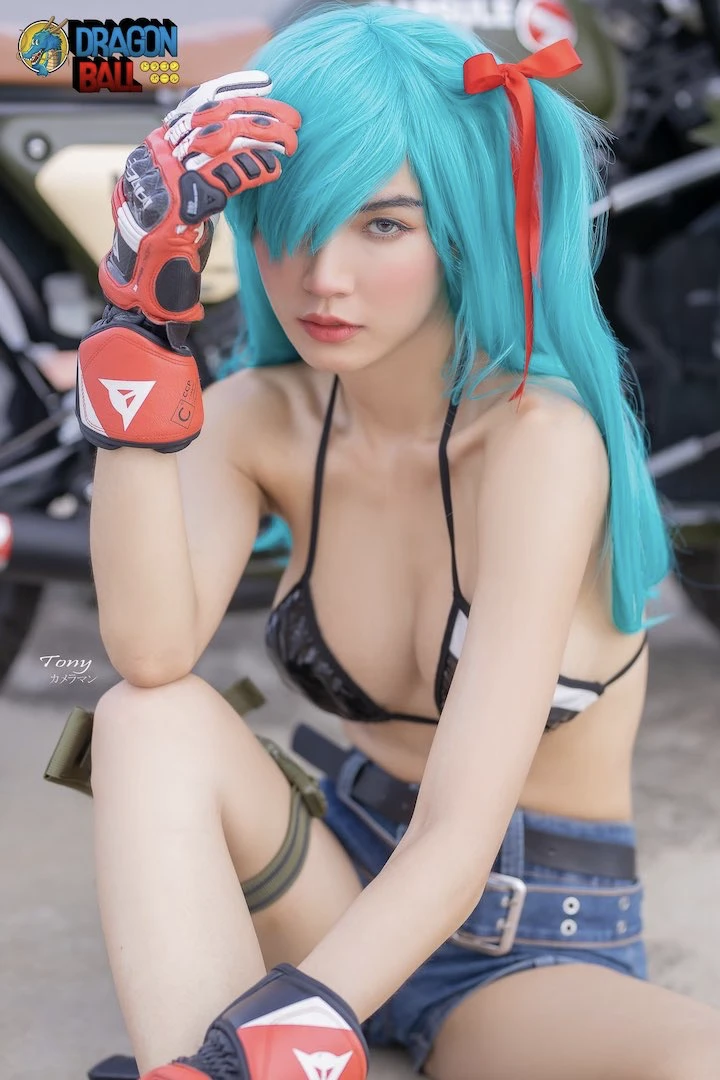maeylin lin posing as an anime character for a sexy cosplay, wearing a tiny short and a bikini and having long blue hair