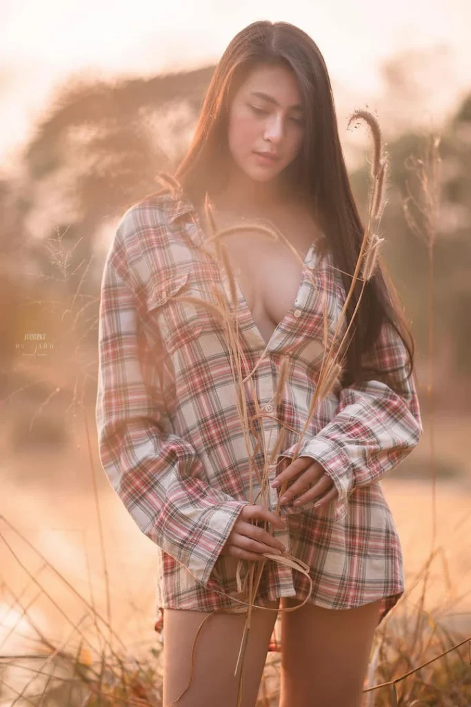 Ruangkaw Lunsakaewong in a sexy shirt in a wheat field
