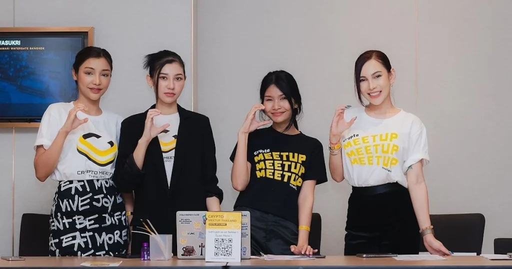 Thai girls at the booth of a Crypto Meetup Thailand event in Bangkok in 2023